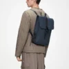 rains-backpack-mini-navy (2) Rains Backpack Mini Navy worn by model