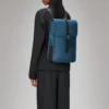 Rains Backpack Mini Pulse worn by model