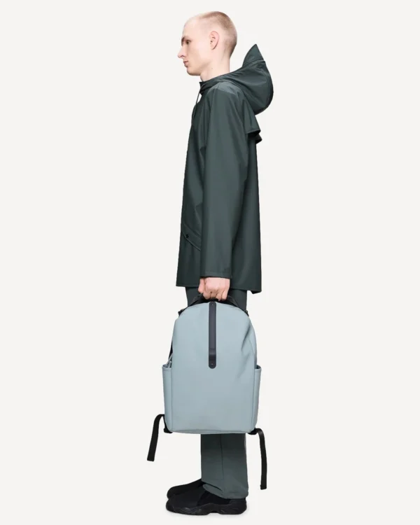 Rains Clip Front Backpack pool worn by model