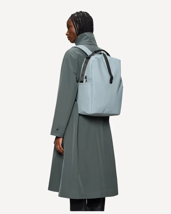 Rains Clip Front Backpack pool worn by model