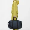 Rains Hilo Weekend Bag Navy worn by model
