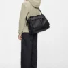 rains-otaru-weekend-travel-bag-small-black (2) Rains Otaru Weekend Bag Small black worn by model