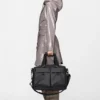 rains-otaru-weekend-travel-bag-small-black (5) Rains Otaru Weekend Bag Small black worn by model