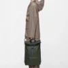 rains-rolltop-rucksack-green (6) Rains Rolltop Rucksack Green worn by model