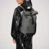 Rains Rolltop Rucksack Grey worn by model