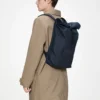 rains-rolltop-rucksack-navy (2) Rains Rolltop Rucksack Navy worn by model