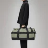 rains-texel-duffel-bag-drift (1) Rains Texel Duffel Bag Drift worn by model