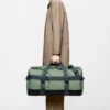 Rains Texel Duffel Bag Well worn by model