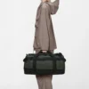 Rains Texel Duffel Bag Small Green worn by model